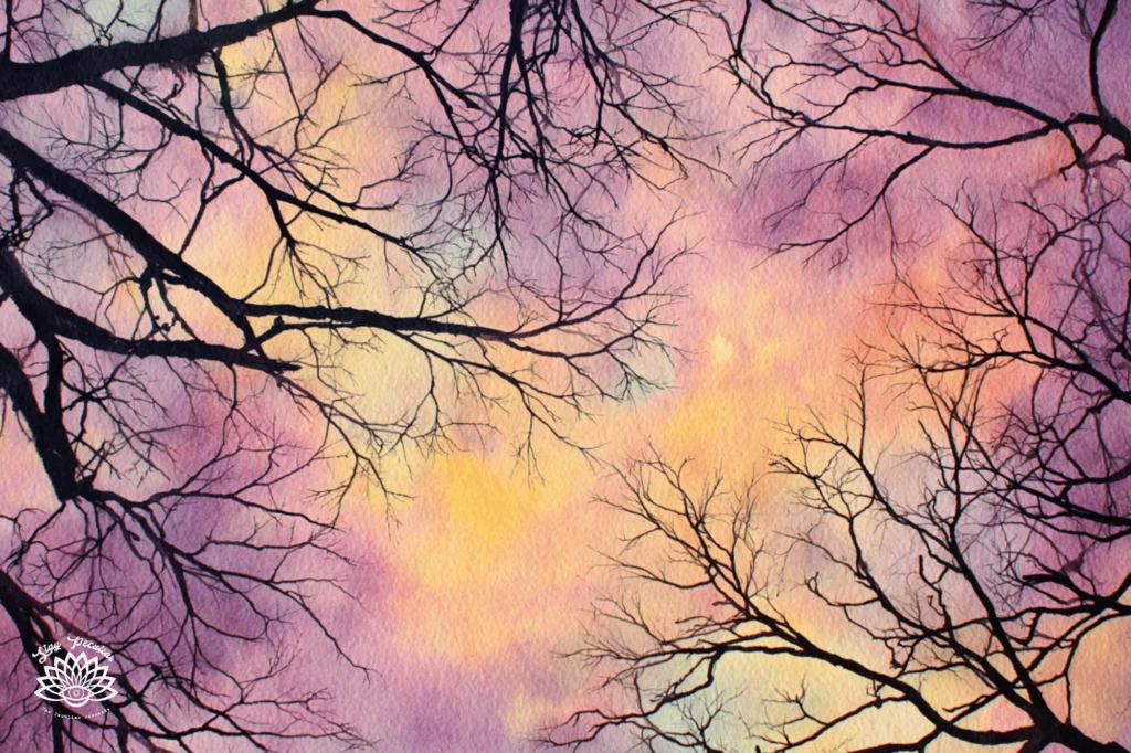 Looking up at the sky and clouds through dark bare branched trees. The sun is rising and the sky is purple, pink, and golden yellow. Brigid was born from the sunrise.