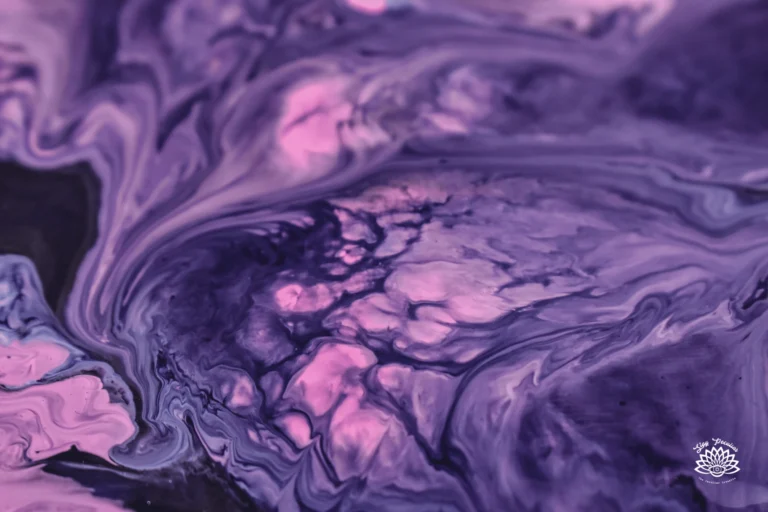 Purple Candle Meaning: image of a swirls of purple paint in shades of dark purple, lilac purple, and a pink-lavender purple.